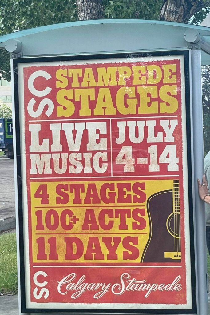 A poster promoting "Stampede Stages LIVE MUSIC JULY 4-14" at the Calgary Stampede, featuring 4 stages, 100+ acts over 11 days, in a bold red and yellow design with a guitar illustration.