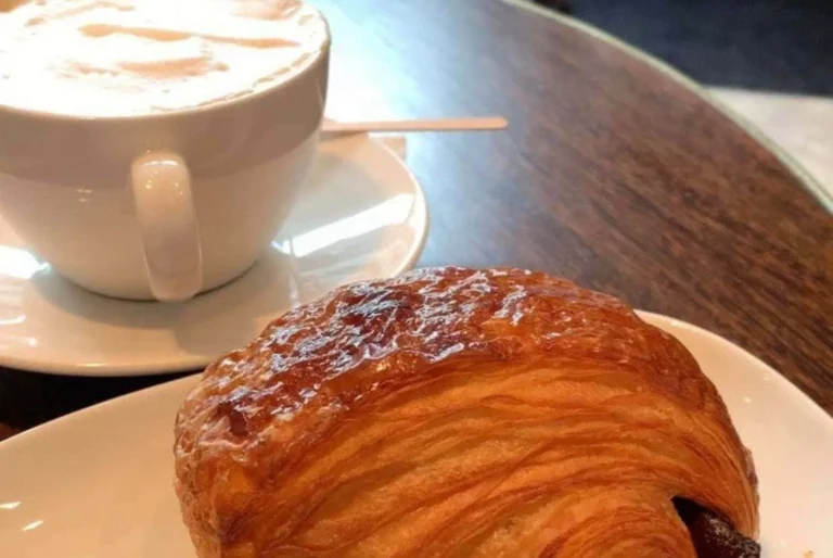 croissant and a cup of coffee