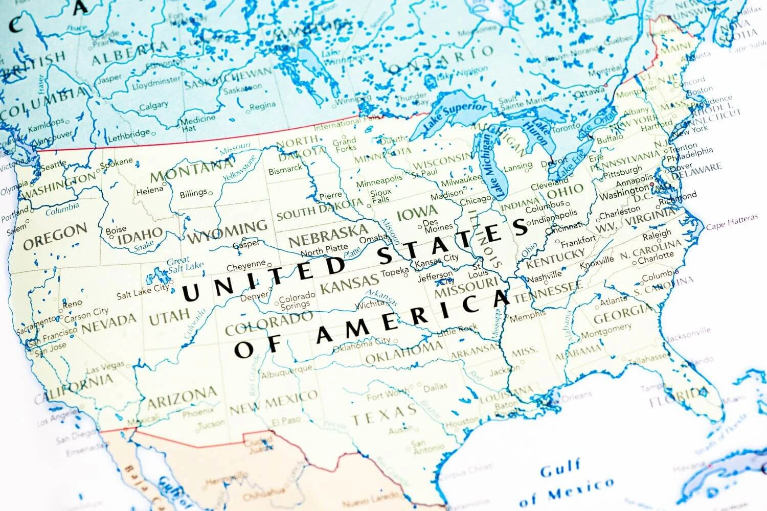 A detailed map of the United States of America highlighting states, major cities, and geographic features in pastel tones.