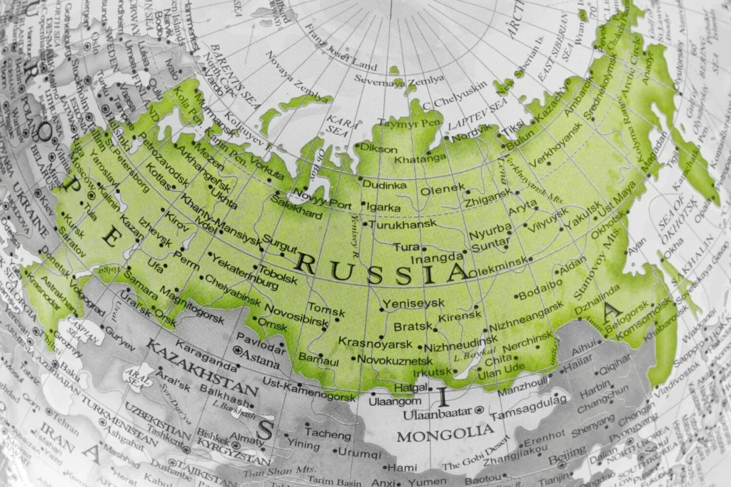 A map highlighting the eastern portion of Russia with green shading, showing cities, rivers, and geographic details, surrounded by neighboring countries and regions.