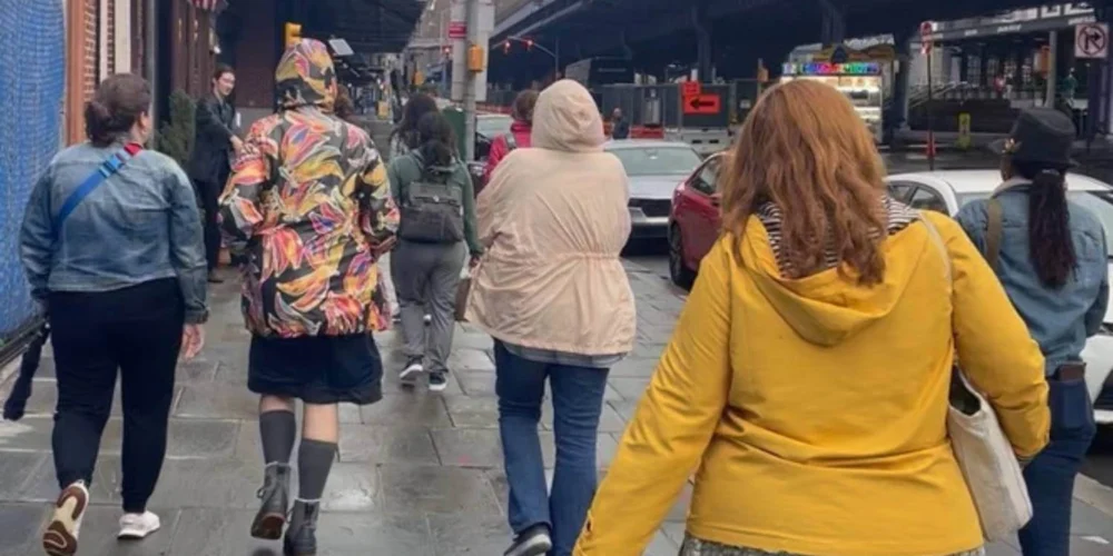 Women walking together in a city, symbolizing the collective influence of female travelers on local tourism.