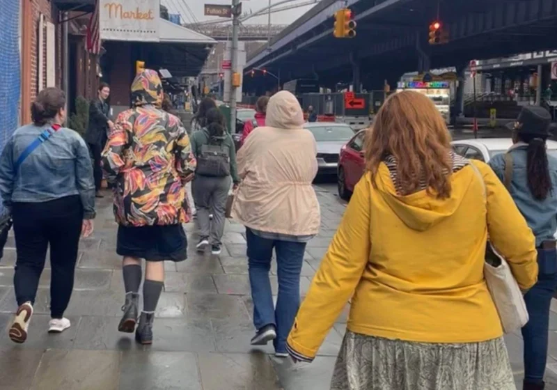 Women walking together in a city, symbolizing the collective influence of female travelers on local tourism.