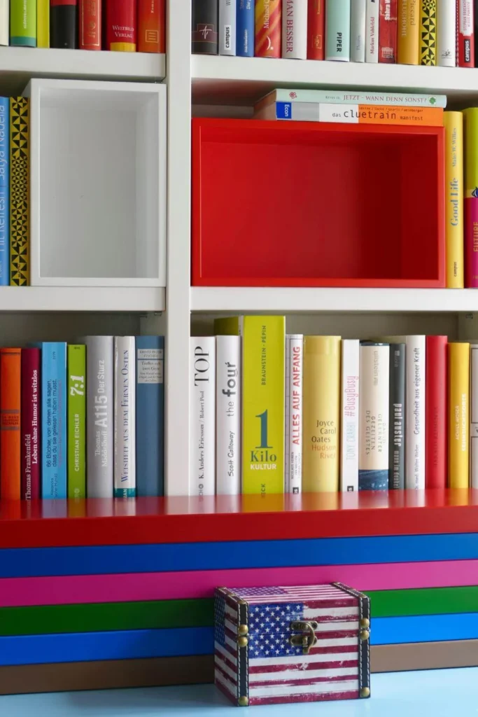 A young child looking through books on a library shelf, symbolizing the importance of giving the next generation access to banned books in America.