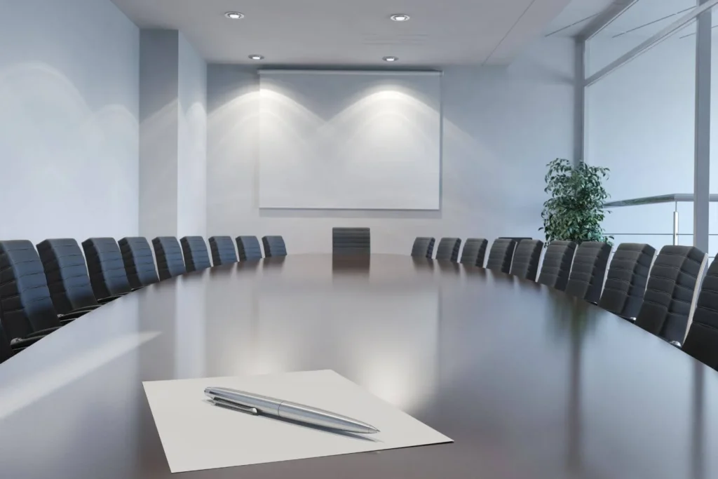 Empty corporate boardroom symbolizing centralized control of media narratives and executive influence over news coverage.