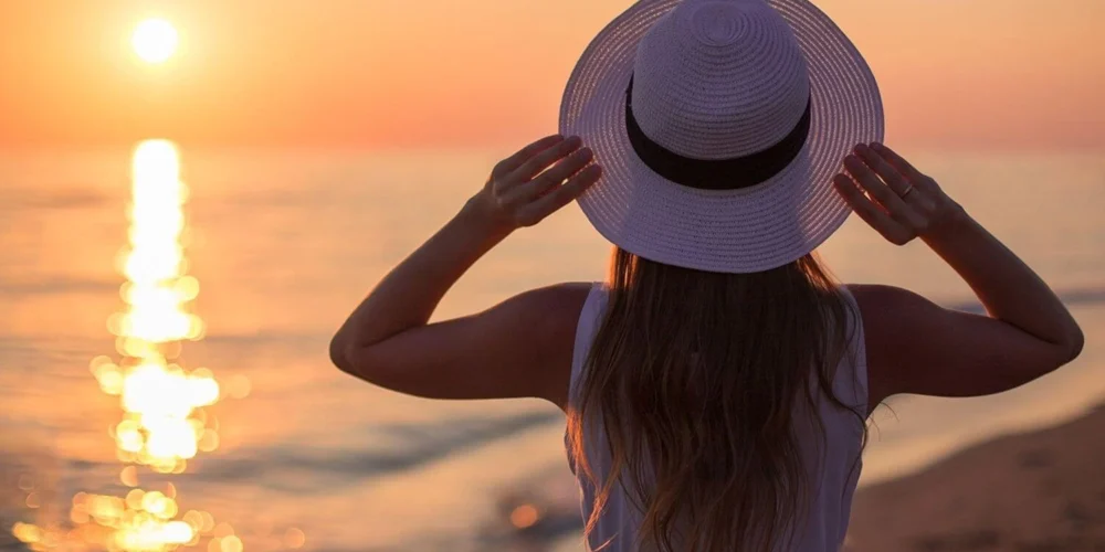 positive-travel-affirmations-solo-female-traveller-sunset-beach.