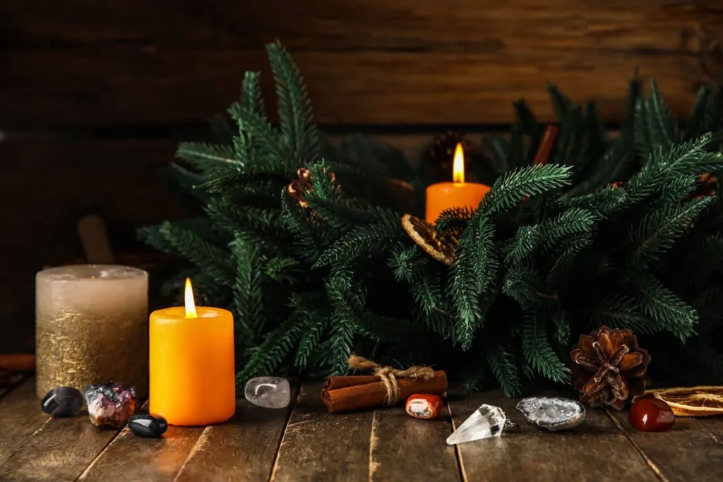 A peaceful Christmas altar with candles, crystals and winter greenery — a calming visual for spiritual holiday self care and Yule rituals.