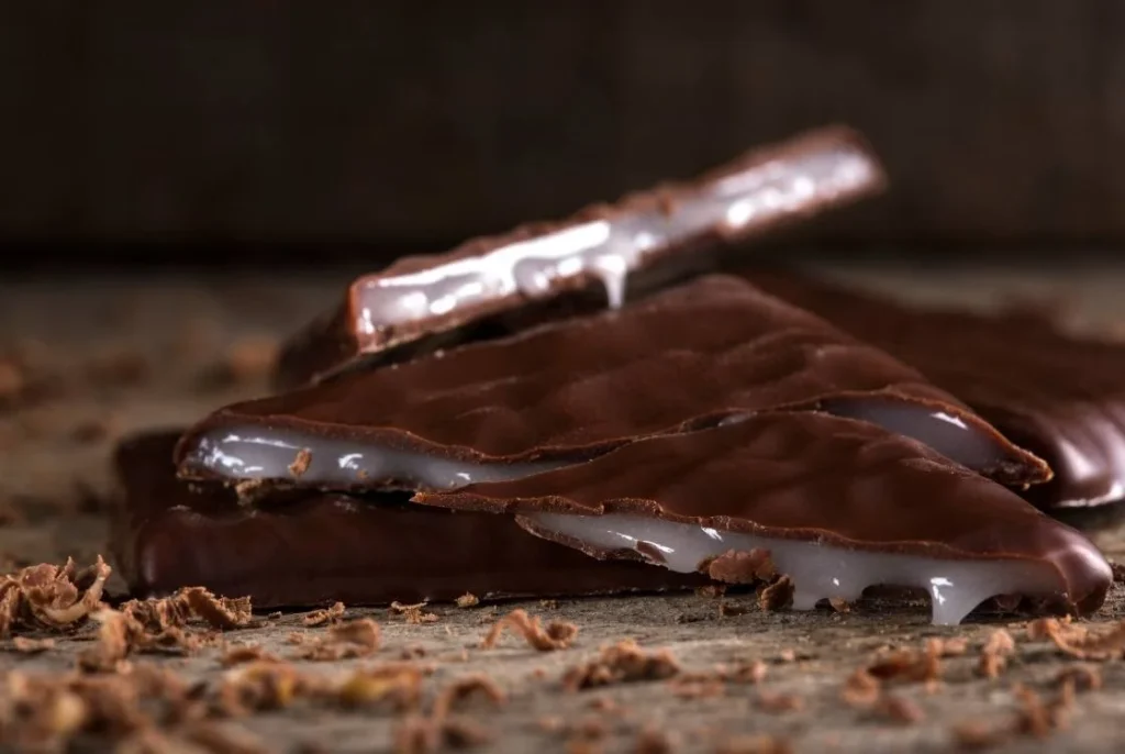 After Eight mint chocolates stacked on a table, a traditional British Christmas chocolate served after dinner.