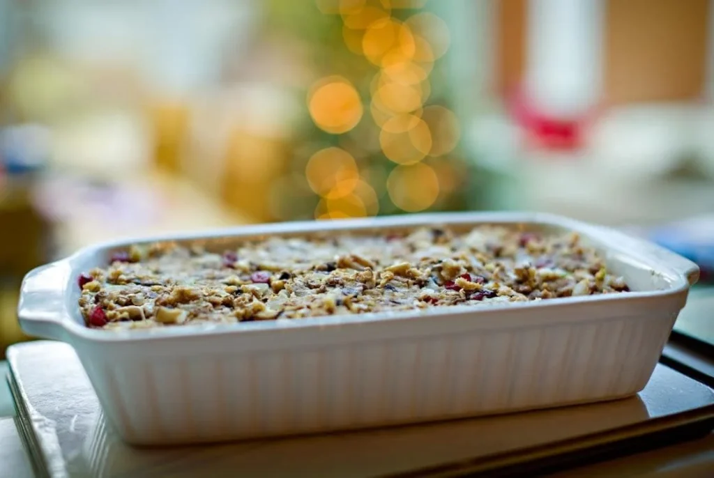 Traditional British Christmas nut roast baked in a ceramic dish, a popular vegetarian main served during Christmas dinner in the UK.