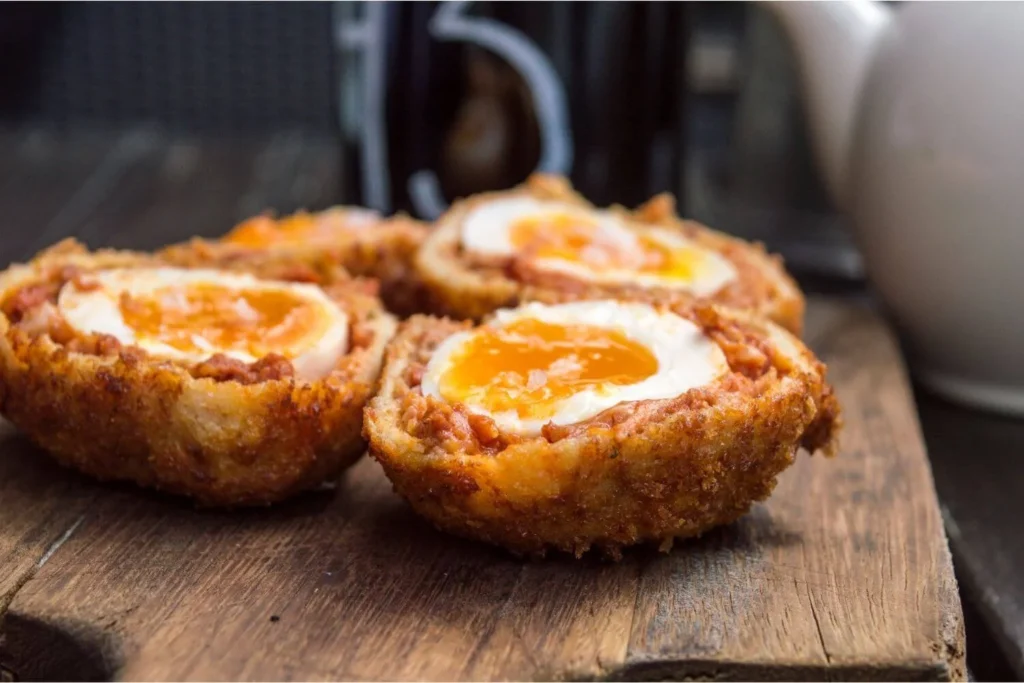 Scotch eggs with runny yolks served as a popular British Christmas party snack. 