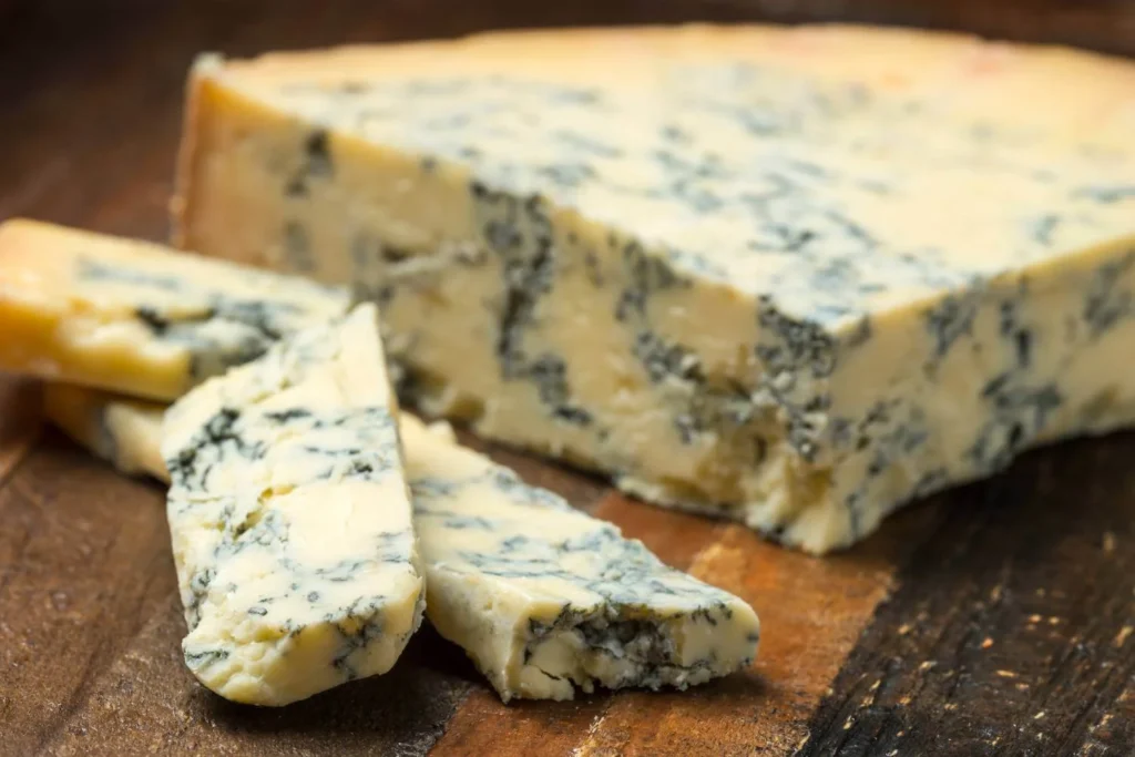 Traditional British Stilton cheese served as part of a Christmas cheese board or festive meal.