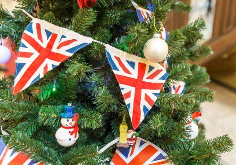 British Christmas tree decorated with Union Jack bunting and festive ornaments, reflecting traditional British Christmas traditions.