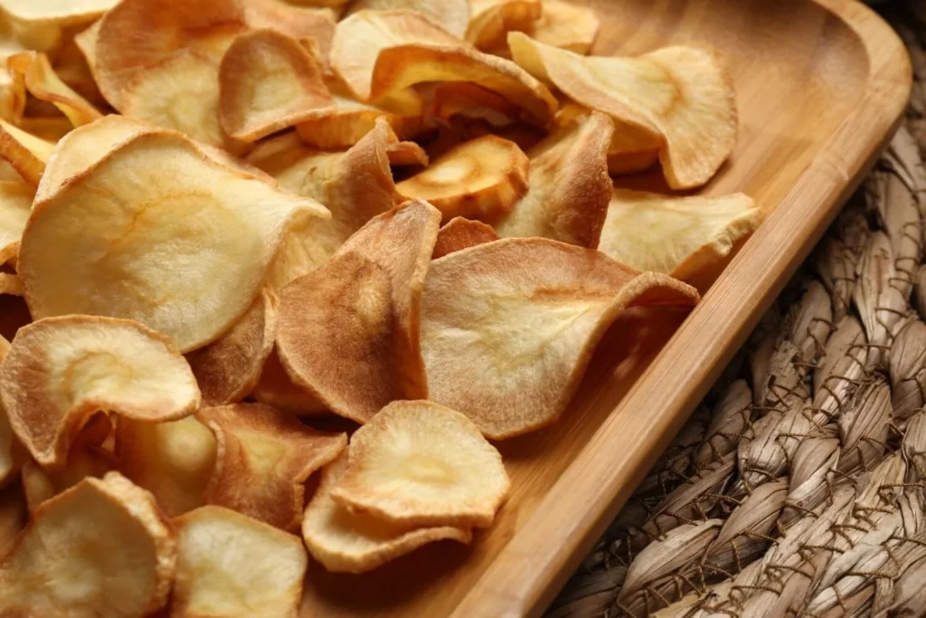 Crispy parsnip chips served as a British Christmas snack or festive grazing nibble. 