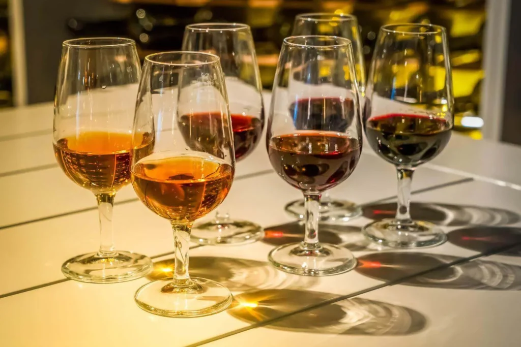 Glasses of port wine served at a Christmas port tasting after dinner.