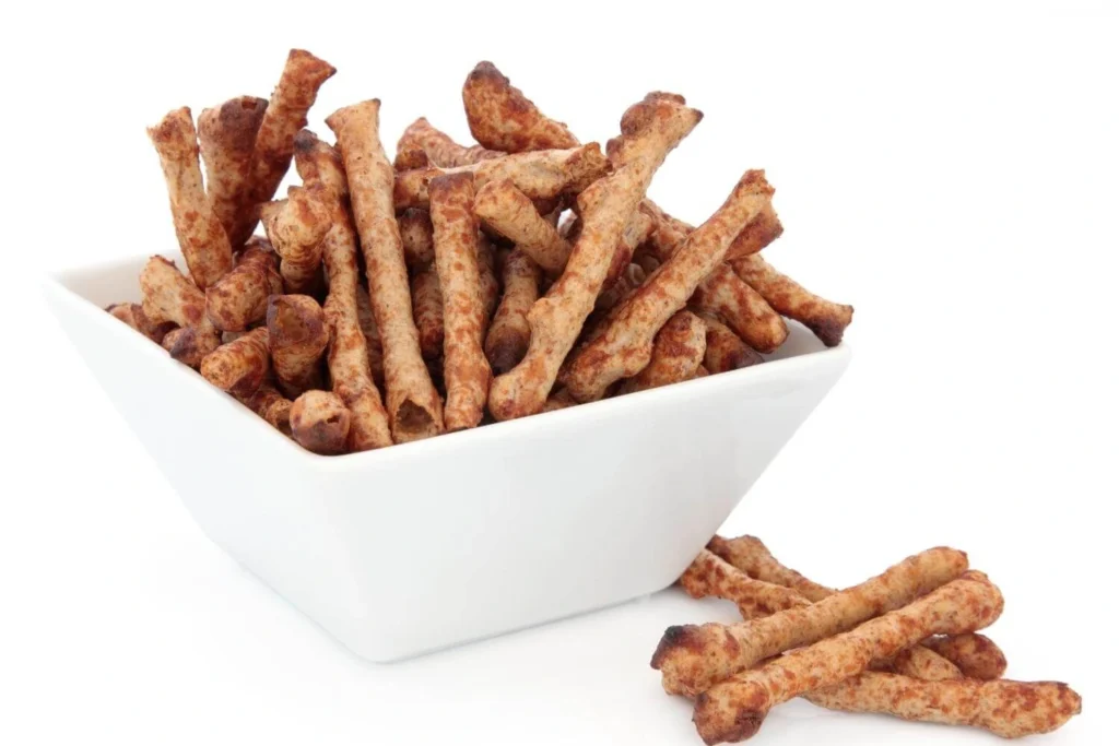 Twiglets, a classic British savoury snack commonly served in bowls during Christmas gatherings. 