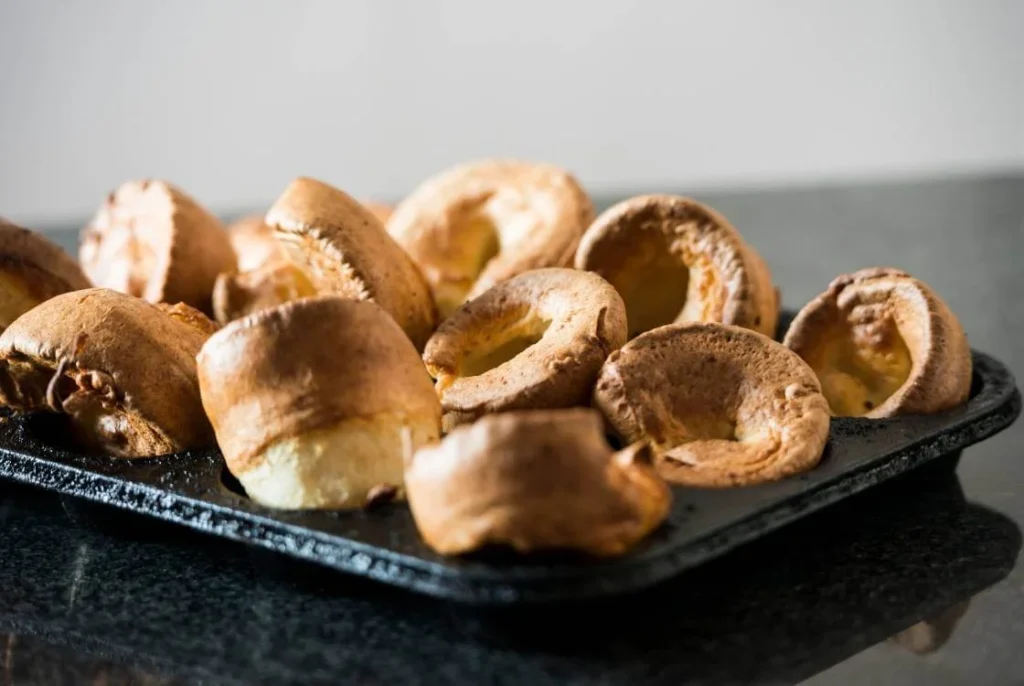Freshly baked Yorkshire puddings served as part of a traditional British Christmas meal. 