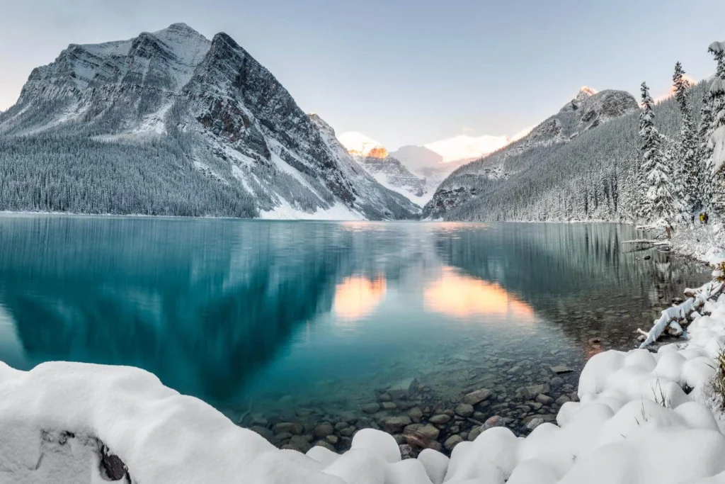Lake Louise in winter with snow-covered mountains, one of the best places to visit in Canada during winter.
