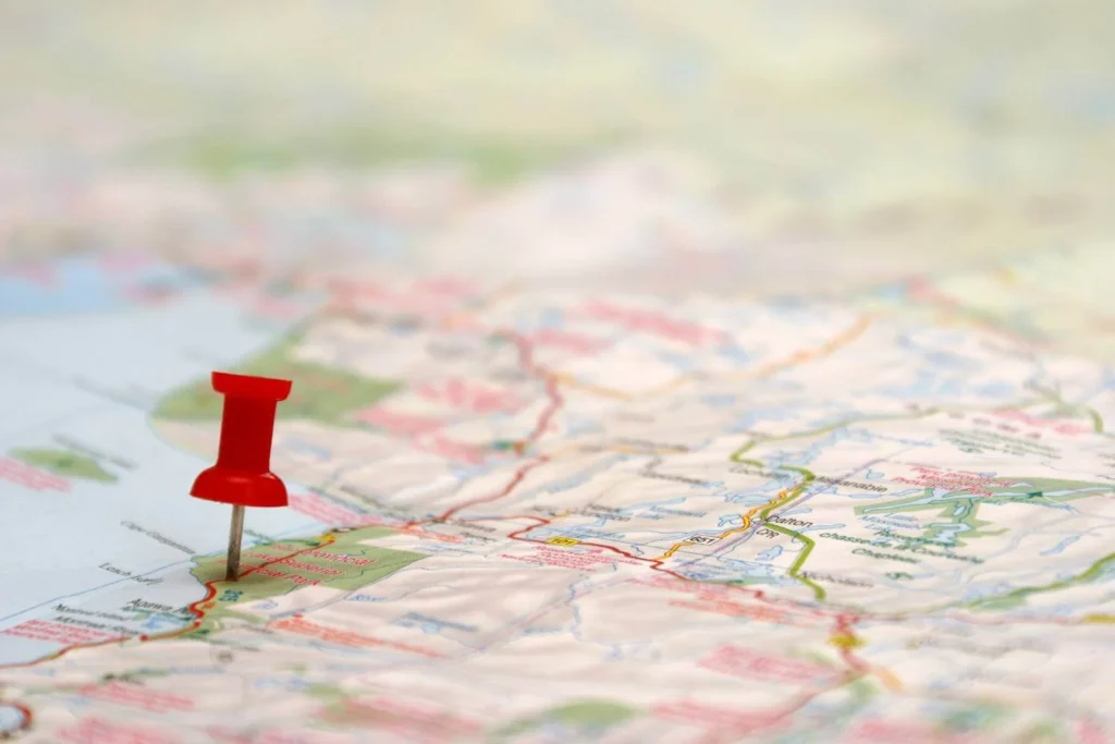 Map with a red pin marking a destination during the solo travel planning process.