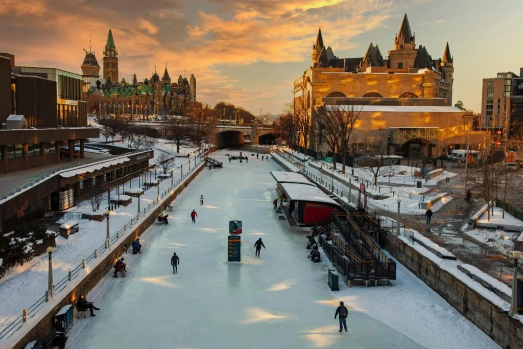 People ice skating on the Rideau Canal Skateway in Ottawa during Winterlude festival.