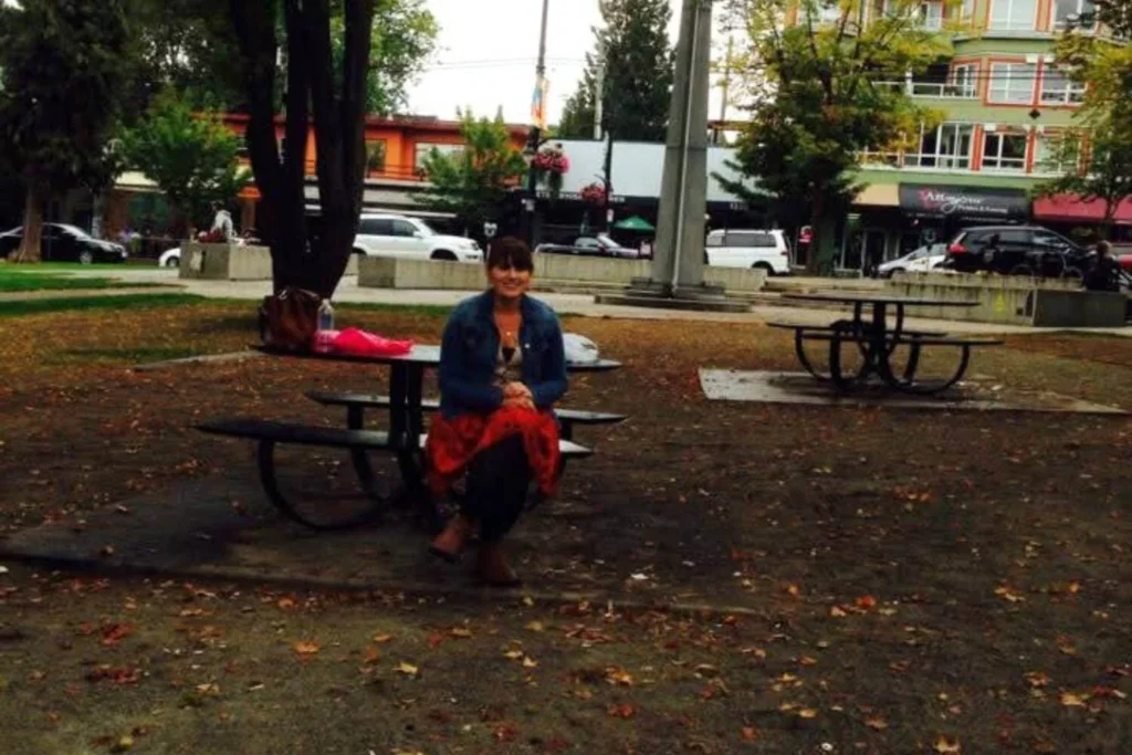 Female solo traveler spending time alone in a Canadian park in Canada, showing confidence and comfort traveling solo.