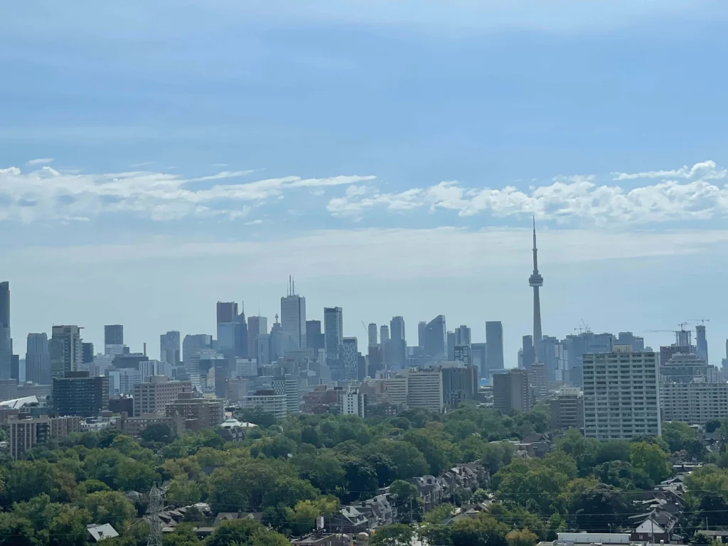 Toronto skyline with the CN Tower on a clear day, one of the best cities to visit in Canada alone as a solo female traveler.